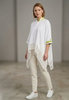 Image of Berek Foil Trim Laser Cut Woven Hem Single Button Closure Batwing Top - White/Lime