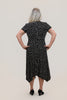 Image of Steven Guy Plus Size Surplice Neckline Short Sleeve Handkerchief Hem Dotted Dress - Black/Vanilla
