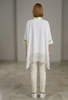 Image of Berek Foil Trim Laser Cut Woven Hem Single Button Closure Batwing Top - White/Lime