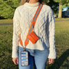 Image of Save The Girls Clip & Go Reflective Strap with Zippered Pouch - Orange